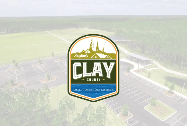 Clay County logo with townscape and slogan.